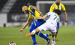 Yacine Brahimi of Al-Gharafa SC and Younes Hussein Abdelrahman of Al-Ahli SC compete durin...