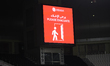 A stadium screen displays a security alert message during the Qatar Stars League match bet...
