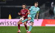 Mario Hermoso of A.S. Roma and Lewis Ferguson of Bologna F.C. are in action during the UEF...