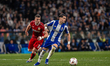 Borja Sainz of FC Porto runs with the ball under pressure from Ermedian Demirovic of VfB S...
