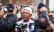 Arjun Narsingh KC, a leader of the Nepali Congress, speaks to the media outside the party’...