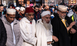 Members of the Muslim community pray in 'Parco Dora' as part of Eid al-Fitr celebrations i...