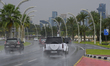 Motorists drive along wet roads in Doha, Qatar, amid rainfall on the first day of Eid al-F...