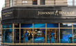 The Johnnie Walker logo is displayed above the entrance to the Johnnie Walker Experience l...