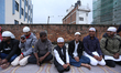 Followers of Islam participate in a mass Namaz recitation ceremony at a mosque in Kathmand...