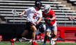 Colin Kelly of the Rutgers Scarlet Knights drives the ball against Dominic Shaw of the Ohi...