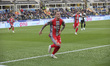 Jari Vandeputte of US Cremonese celebrates after scoring with Jamie Vardy and teammates du...