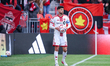 Toronto FC midfielder Jonathan Osorio prepares to take a throw-in during a Major League So...