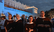 A group of Nuns surrounded by pilgrims from around the world enjoy the concert on Krakow's...
