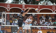 Nicolas Capogrosso of Argentina spikes the ball against Jack Pearse of Australia during th...