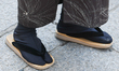 Traditional japanese sandals are seen wearing by a person at Fushimi Inari Shrine in Kyoto...