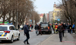 People remain near the scene of a Russian drone strike in Ivano-Frankivsk, Ukraine, on Mar...