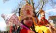 A boy dressed as the Hindu deity Hanuman participates in a religious procession as Kashmir...