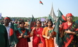 People place wreaths at the National Memorial in Savar to pay tribute to the Liberation Wa...