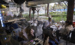 Young Iranian women talk with each other as they sit at a cafe in Tehran, Iran, on March 2...