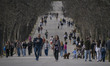 People walk near El Retiro Park in Madrid, Spain, on March 23, 2026. El Retiro Park is one...
