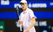 Jannik Sinner of Italy gestures with his racket during his semifinal match against Alexand...
