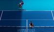 Jasmine Paolini and Sara Errani of Italy serve against Taylor Townsend of the United State...