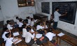 Indian students reading in a classroom during the nation-wide strike called by central tra...