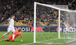 Denys Garmash of FC Dynamo Kyiv (L) scores a goal with his team mates during the UEFA Cham...
