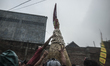 People scramble bakpia during event Bakpia Carnival walk in Yogyakarta, Indonesia, on Sept...