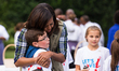 On Thursday, Oct. 6, First Lady Michelle Obama hugs students as she says goodbye, after he...