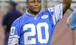 Detroit Lions former Barry Sanders RB (20) greets the crowd while being honored along  wit...
