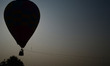 Indian pilgrims,who visit for Holy dip, looks on  hot air balloon ,on the banks of holy Sa...