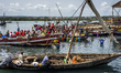 People bargain for better price to buy fish in a local fish market at the old dhow harbor,...