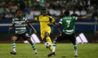 Dortmund's forward Ousmane Dembele (C) vies for the ball with Sporting's midfielder Marvin...