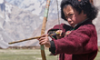 A Ladakhi boy aiming his bow while learning traditional archery in Zanskar, Ladakh, Jammu...