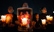 Thai People hold up a picture Thailand's new King Maha Vajiralongkorn Bodindradebayavarang...