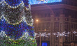 People celebrate the New Year´s Day in the Lenin square under a Christmas tree and a large...