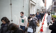 People wait in a queue line for the gate of Matsuya Ginza Department store to purchase the...