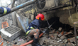 Bangladeshi firefighters try to douse flame after a fire broke out in a market at Gulshan,...