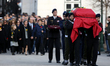 Portuguese military guards carry the coffin during the funeral of the late former Portugue...