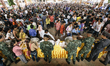 Cambodian migrant workers are fed by the Thai military before they cross the border and re...