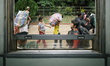 Cambodian migrants arrive by train at Aranyapathet Railway Station in Thailand before cros...