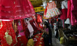 Indonesians Chinese ethnic purchase ornaments ahead of the Lunar New Year at a market stal...