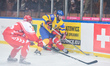 Ukraine's Shamil Ramazanov challenged by Poland's Maciej Kruczek and Filip Komorski (Left)...