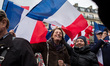 Supporters holding French flags gather for a rally in support of French presidential elect...