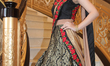 Model wearing an elegant and ornate bridal outfit during a South Asian bridal show held in...