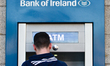 A person using Bank of Ireland cash maschine in Dublin's city center.On Friday, March 24,...