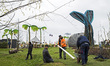 Workers are pictured in the water play area during a press preview of the IGA (Internation...