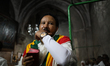 Ethiopian Orthodox Christian worshippers pray in Deir El Sultan monastery on top of the Ch...