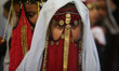 Bedouin girls wears traditional dress during Folklore Exhibition in Gaza city, Palestine,...