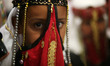 Bedouin girls wears traditional dress during Folklore Exhibition in Gaza city, Palestine,...