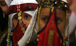 Bedouin girls wears traditional dress during Folklore Exhibition in Gaza city, Palestine,...