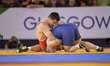 Mike Grundy for England competes against Gerlad Meyer for South Africa at Wrestling as par...