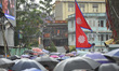 Nepalese people devotees hold flag of Nepal during celebration of Bhoto Jatra festival at...
